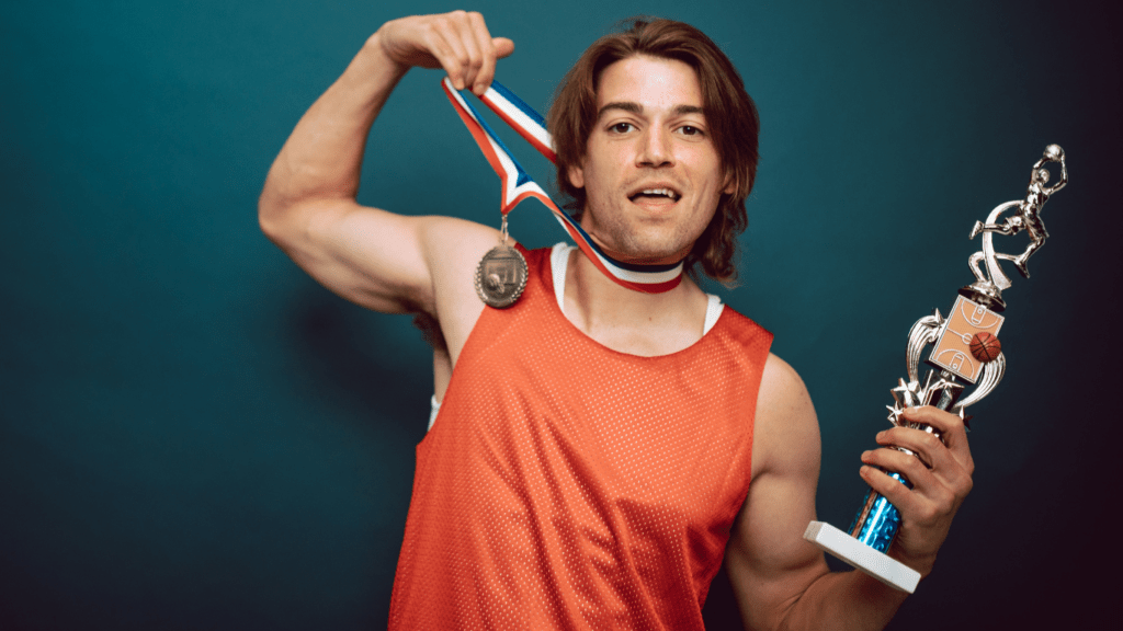 Player holding trophy and medal